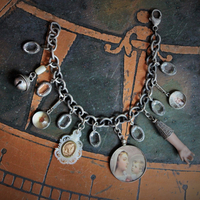All over the Sky Bracelet w/Antique French Medals, Sterling Chain,Antique Glass Picture Locket, 2 Rare Tiny Glass Bubble Lockets,Antique Sterling "Rattle", Antique MOP Glass Inset Notre Dame Drop & More!