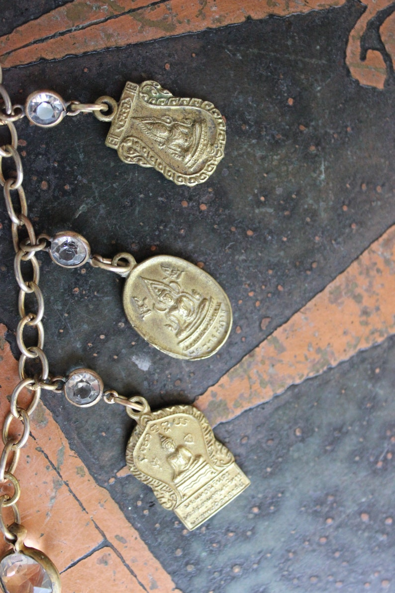 The Unity of Life Necklace w/7 Antique Buddha Sanskrit Medals,Carved Crystal Buddha,Antique Bezel Set Faceted Crystal Connectors+