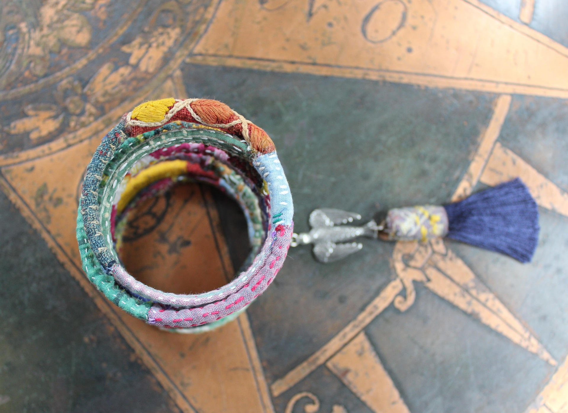 Infinite Possibilities Coiled Kantha & Embroidered Lambani Textile Bracelet with Dove of Peace Medal and Silk Tassel