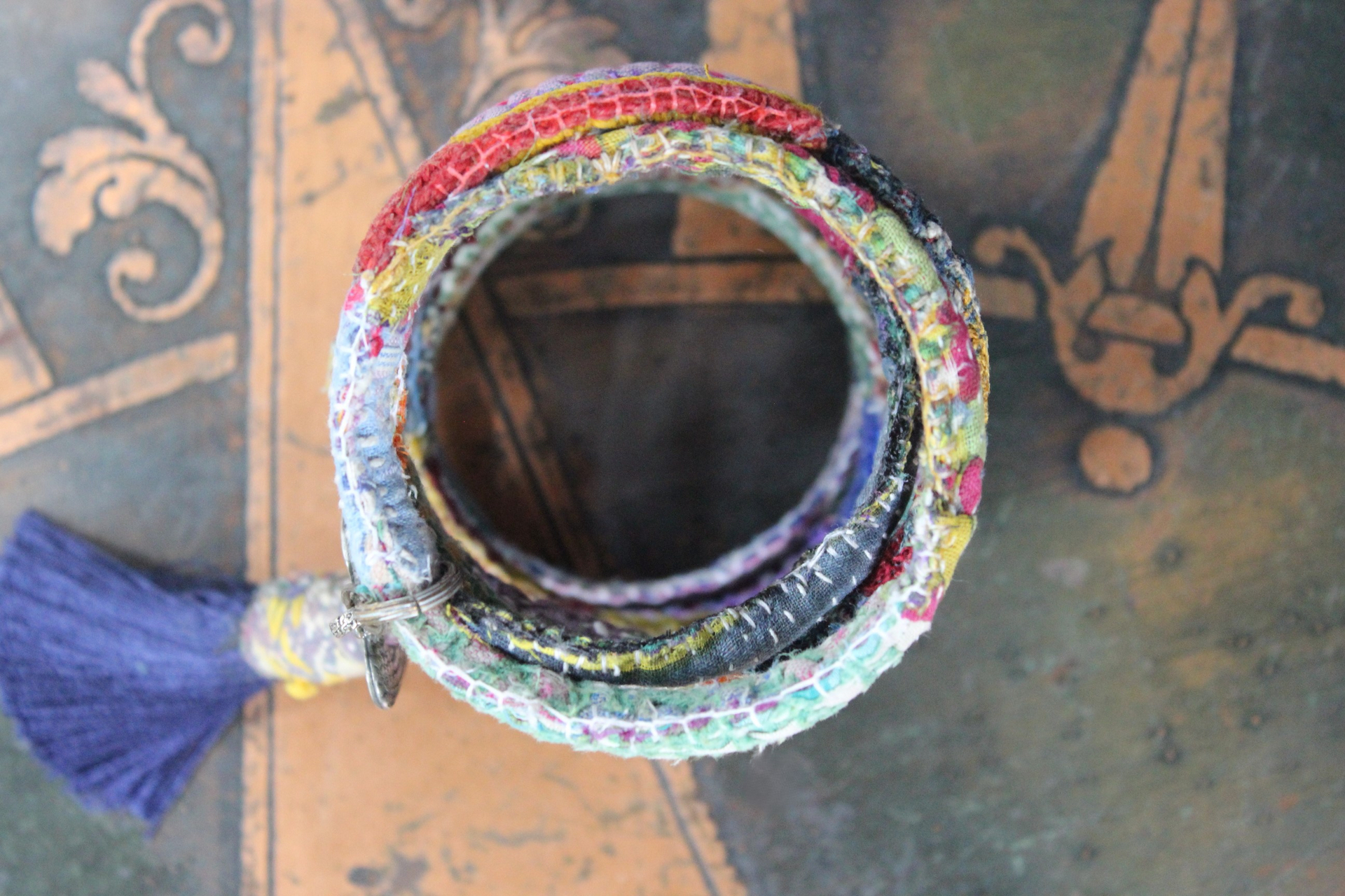 Infinite Possibilities Coiled Kantha & Embroidered Lambani Textile Bracelet with Dove of Peace Medal and Silk Tassel