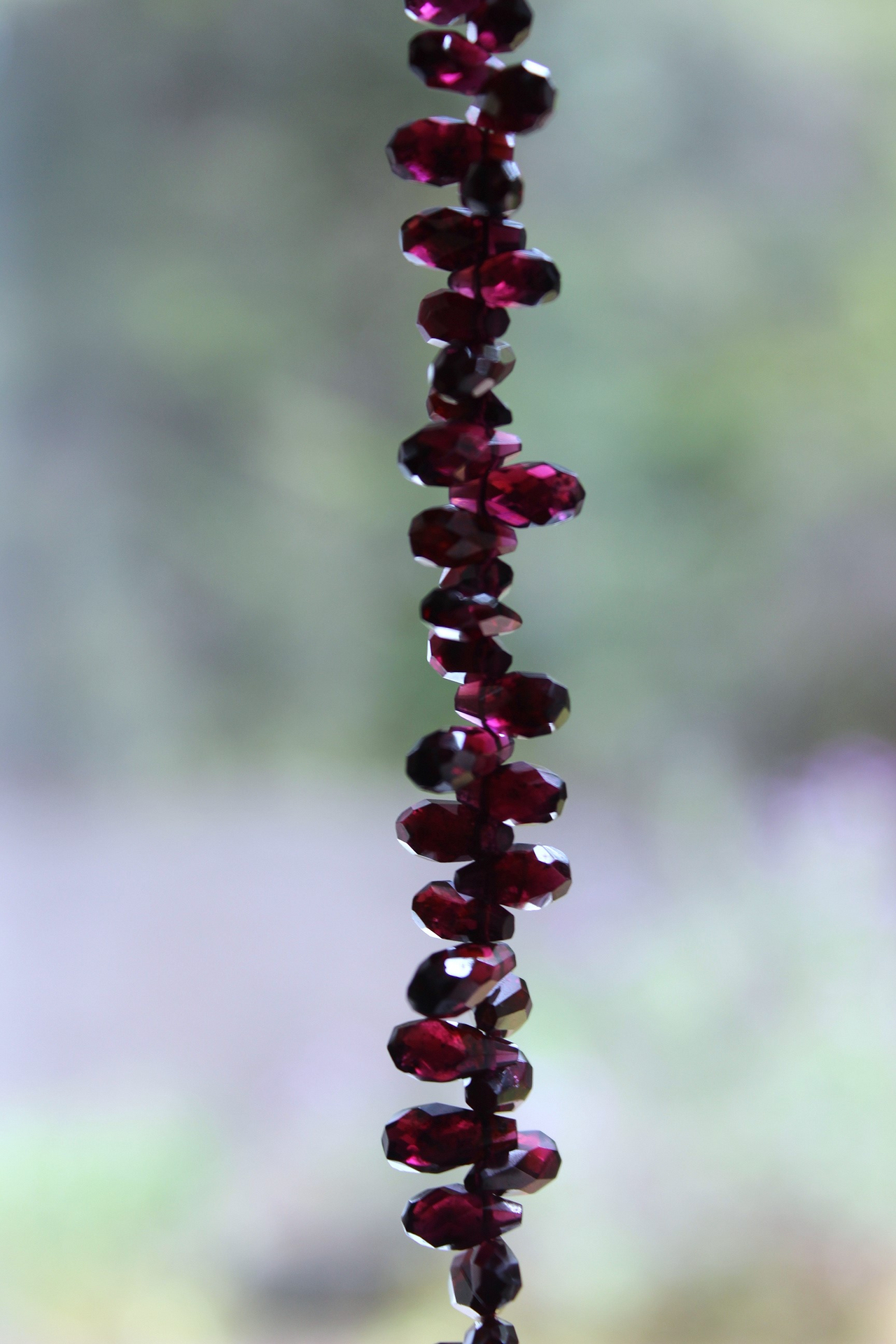 Courage and Hope Necklace with Hundreds of AAA Faceted Almandine Tear Drops, Unique Black Silk Tassel